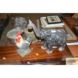 A carved elephant ornament and an ornament in the