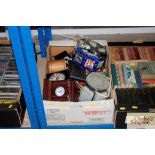 A box of miscellaneous clocks; stationary items; m
