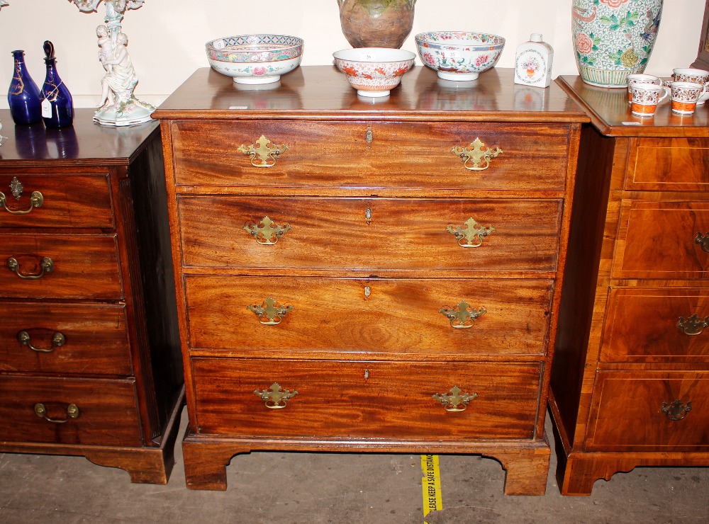 A 19th Century mahogany chest, of four long graduated drawers raised on bracket feet, 95cm wide