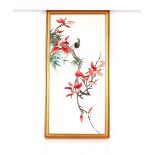 A Chinese silk work embroidered panel, depicting exotic bird on a branch, 70cm x 33cm