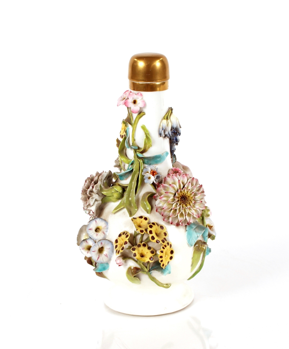 A German porcelain bottle vase, having profuse foliate decoration and gilt stopper, 25cm high - Image 2 of 2