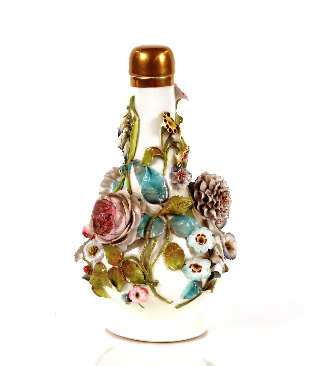 A German porcelain bottle vase, having profuse foliate decoration and gilt stopper, 25cm high