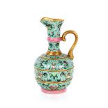 A Chinese famille rose ewer, with bands of scrolling foliate decoration, gilded interior and handle,