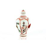 A 20th Century Chinese porcelain snuff bottle and stopper, of lobed outline, painted red four