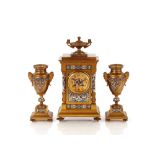 An Ormolu and enamel clock garniture, the clock surmounted by a urn finial, circular dial supporting
