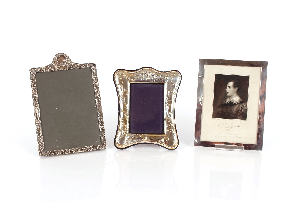 A silver mounted photograph frame, Hallmarked for Birmingham 1924, and enclosing a black and white