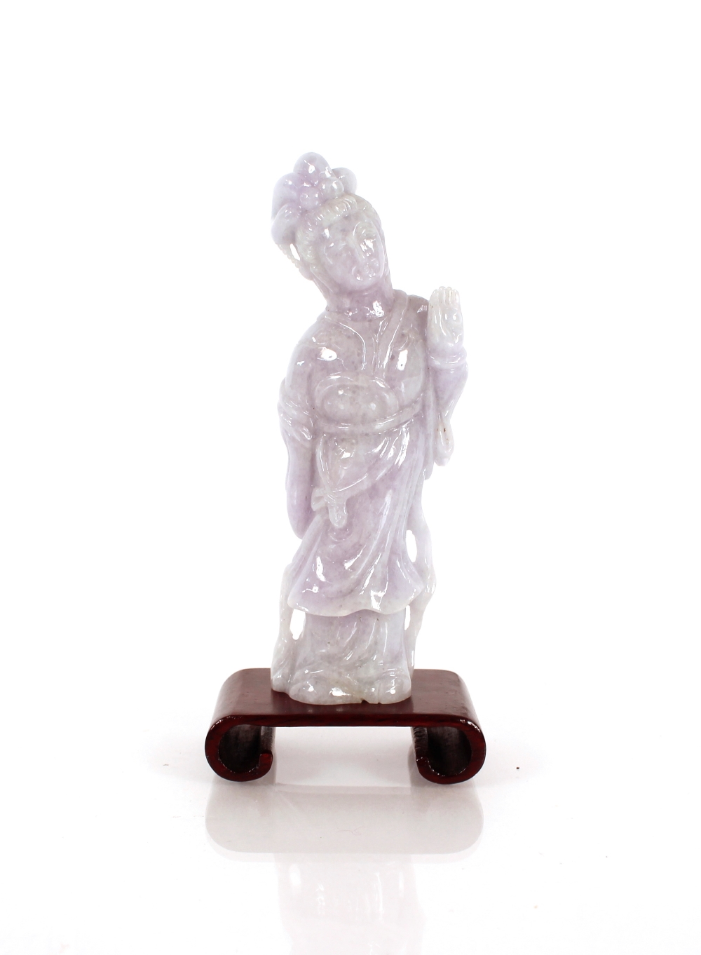 A lavender jade carving of Guan Yin, on a small wood stand 11cm high overall