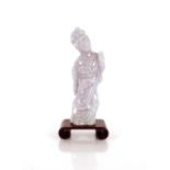 A lavender jade carving of Guan Yin, on a small wood stand 11cm high overall