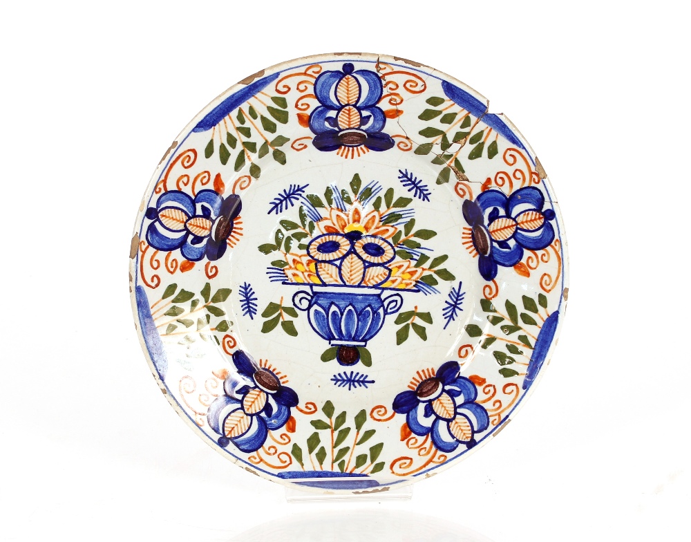 A pair of Delft plates decorated flowers, 23cm dia. AF