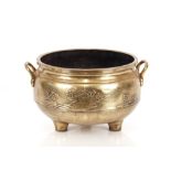 A 19th Century Chinese bronze censer, of large size, flanked by loop handles having raised