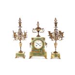 A green marble and gilt metal mounted clock garniture, the clock with circular enamelled floral dial