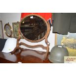 A mahogany and inlaid swing framed toilet mirror