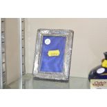 A silver Arts & Crafts photo frame with beaten and