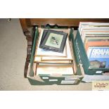 A box of various pictures and prints