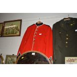 A red dress Uniform with white spiked pith helmet