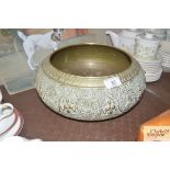 An Eastern decorative brass bowl