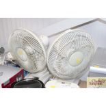 A pair of desk fans