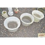 Three concrete garden planters