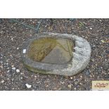 A bird bath decorated with four birds