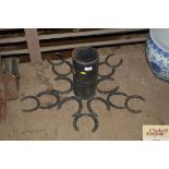 A Christmas tree holder decorated with horseshoes