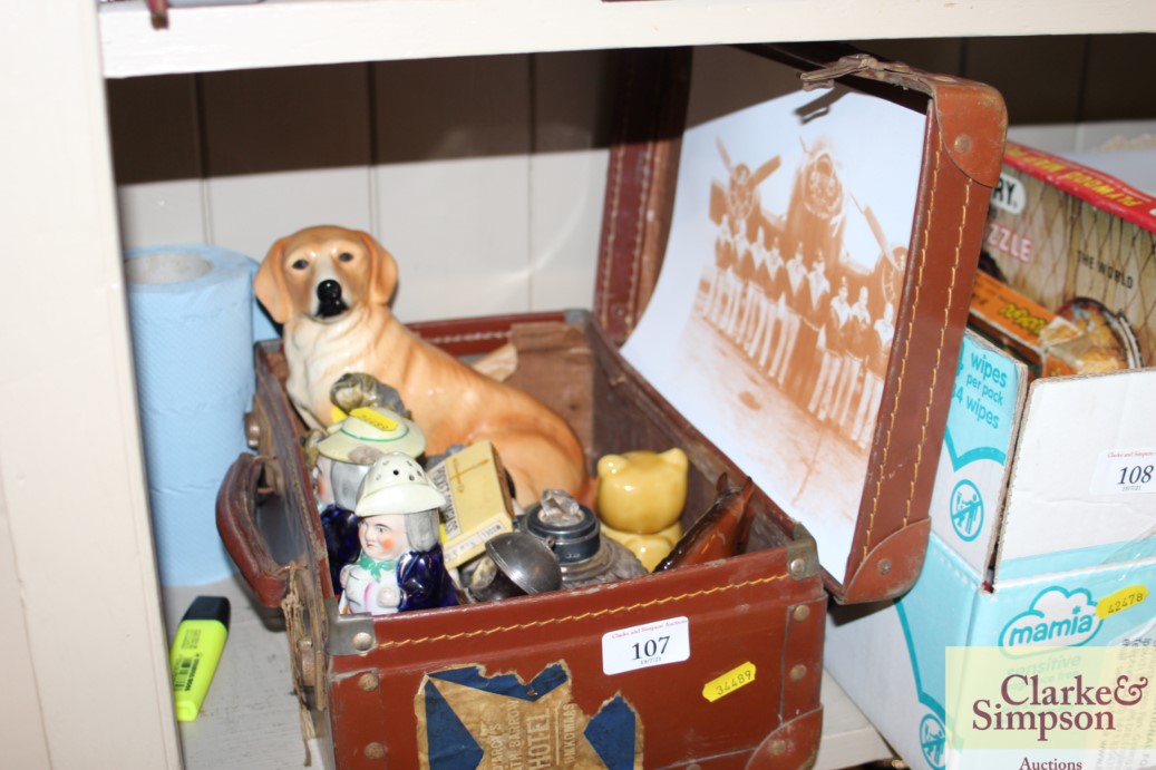 A small vintage suitcase and contents of various c