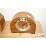 An Art Deco walnut chiming mantel clock