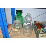 Two glass demi johns and two glass storage jars