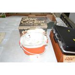 A slow cooker with original box