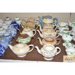 A collection of various vintage teapots