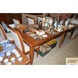 A teak extending dining table and set of six chair