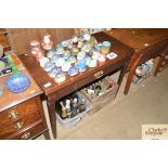 An antique oak tea table fitted with a single draw