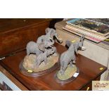 A country Artist figure group of elephants and anot