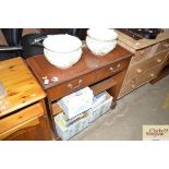 A mahogany two drawer bookcase