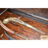 An antique Eastern flintlock pistol