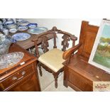 A 19th Century carved oak corner chair