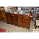 A reproduction mahogany sideboard