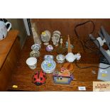 A magnifying glass; various trinket boxes etc