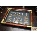 A framed and glazed display of knots etc