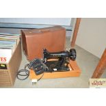 An electric Singer sewing machine sold as collecto