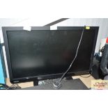 A Toshiba flat screen TV with remote control