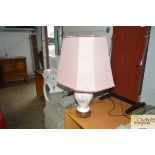 A china table lamp with large pink shade