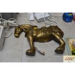 A decorative brass horse ornament
