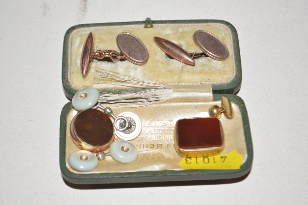 A pair of 9ct gold cuff links; two fobs etc