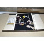 A box of various silver and white metal necklaces,