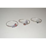 Three hardstone and white metal bangles