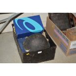 A metal box containing various military uniforms,