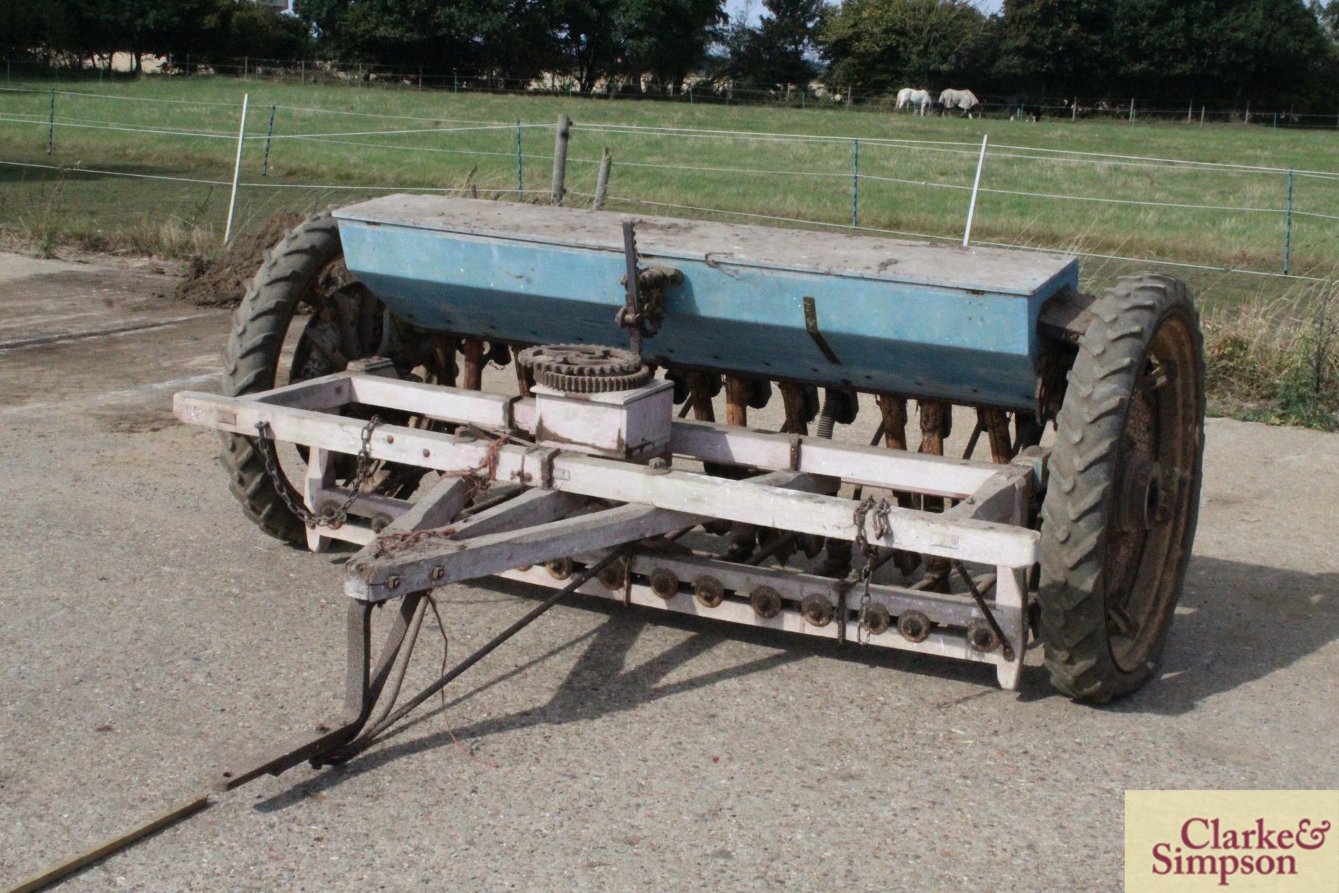 Smyth tractor drawn drill. With pneumatic row crop wheels and tyres.