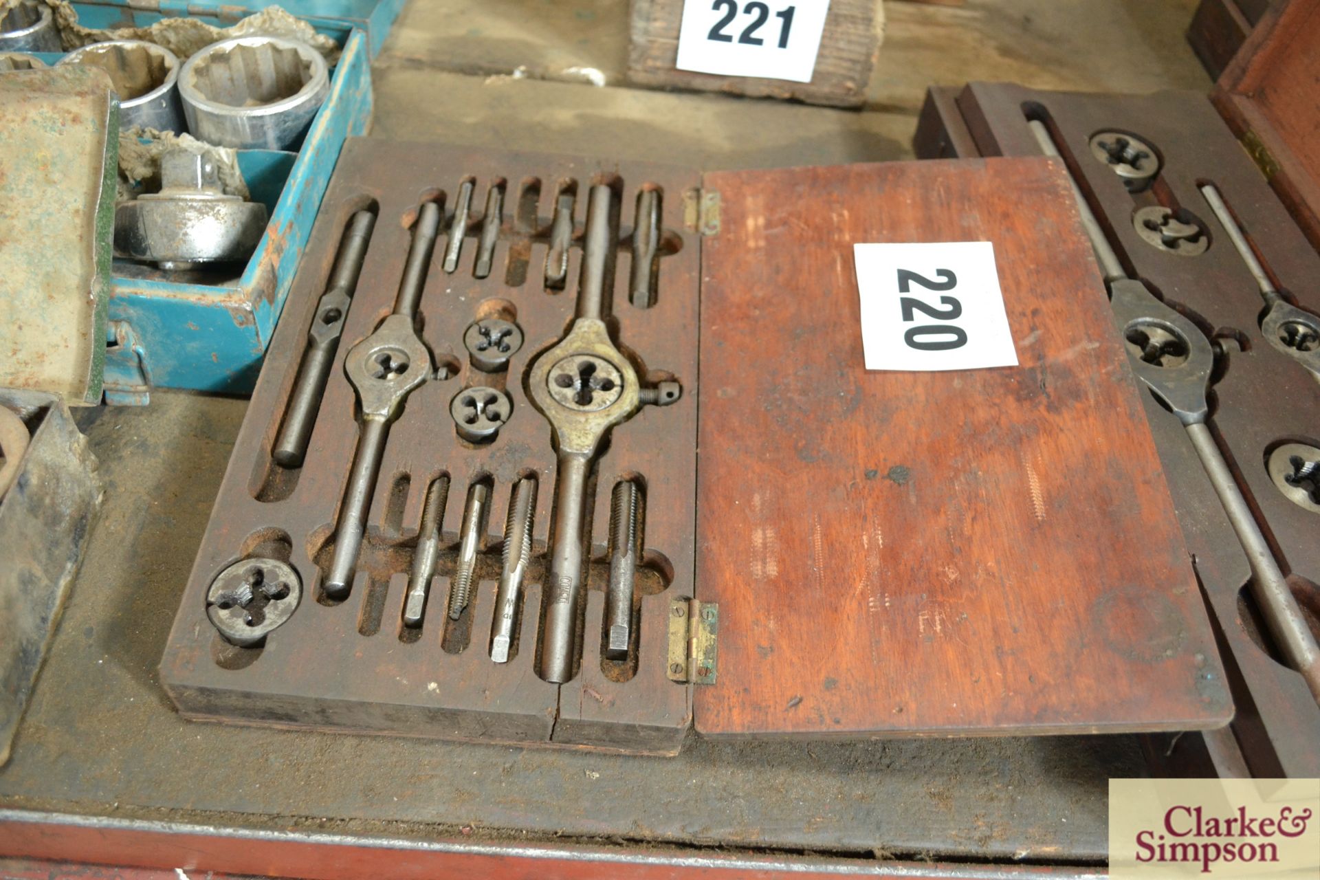Tap and die set in wooden case.