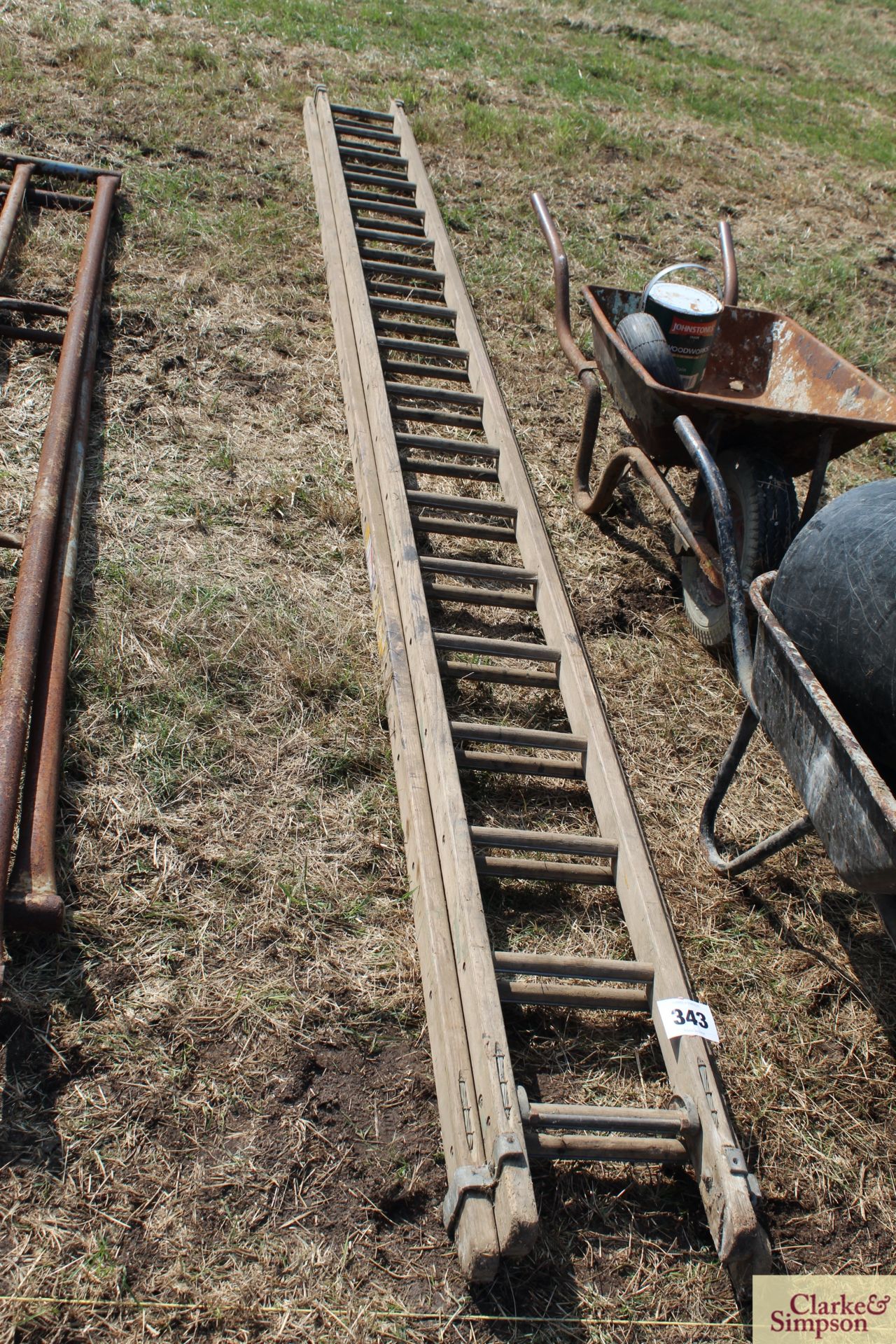 Wooden extending ladder.