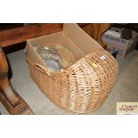 A wicker crib and contents of various upholstery items